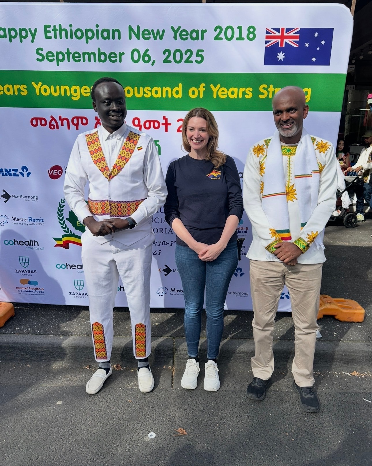 AYC CEO/Founder Isaiah Alier Mashinkok Jr with Maribyrnong MP Katie Hall and Ethiopian Community leader Dr Tesfaye Yigzawe at Ethiopian New Year 2025